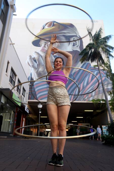 Hula-hoop and aerial performer Shona Conacher turning tricks in Globe Lane, Wollongong. Picture: Robert Peet