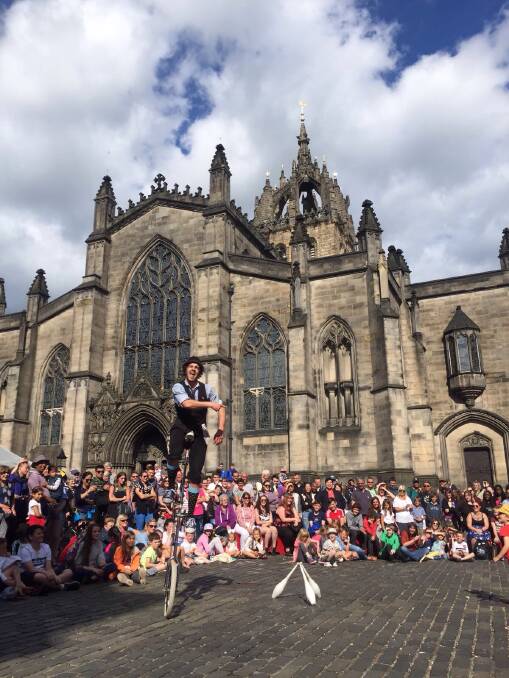 Corey Picket entertains outside Saint Giles Cathedral in Edinburgh, Scotland. The performer spends nine months of the year in the UK and Europe, the rest at home in the Illawarra. Picture: Supplied