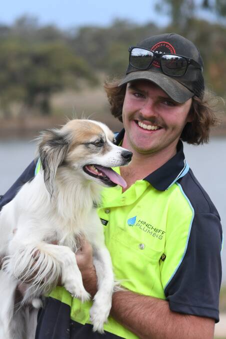 HAPPY AS LARRY: Jack Firth with water dog Buddy. Photo: JUDE KEOGH