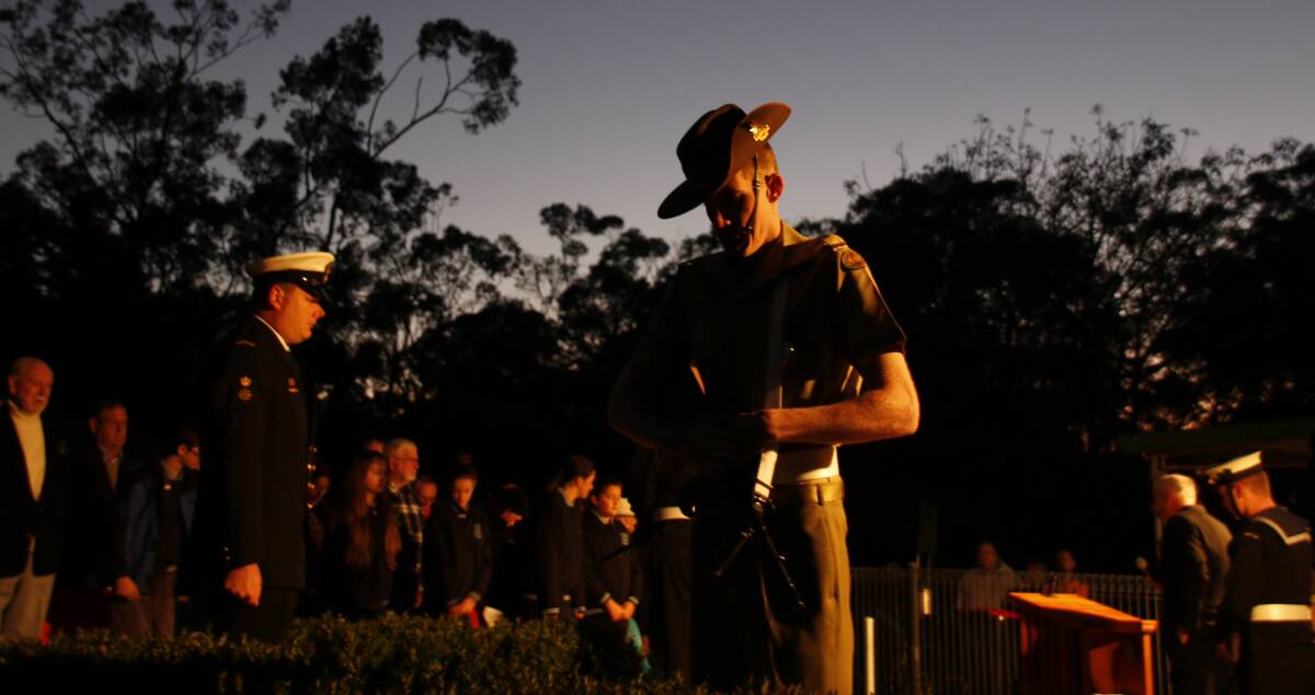 A representative of the Australian army pays his respects at the 2016 Hill Top Anzac Day dawn service. Councillors will be present at each town's service. Photo: Victoria Lee