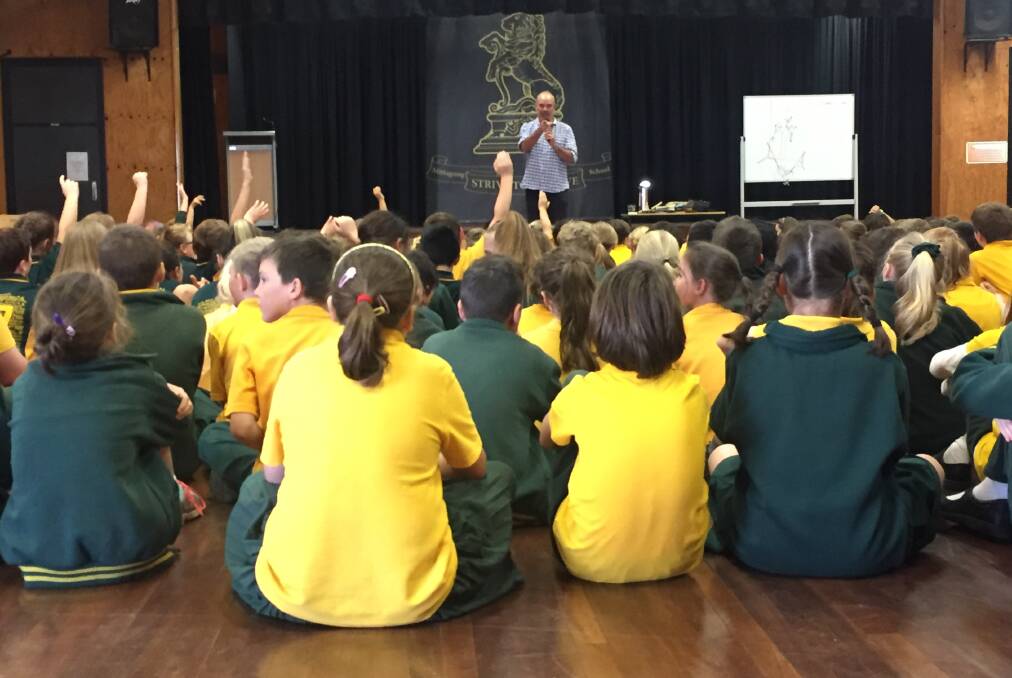 Big ideas: It was all hands on deck with ideas when Andrew Daddo asked Mittagong Public School students to help him write a story. Photo: Victoria Lee
