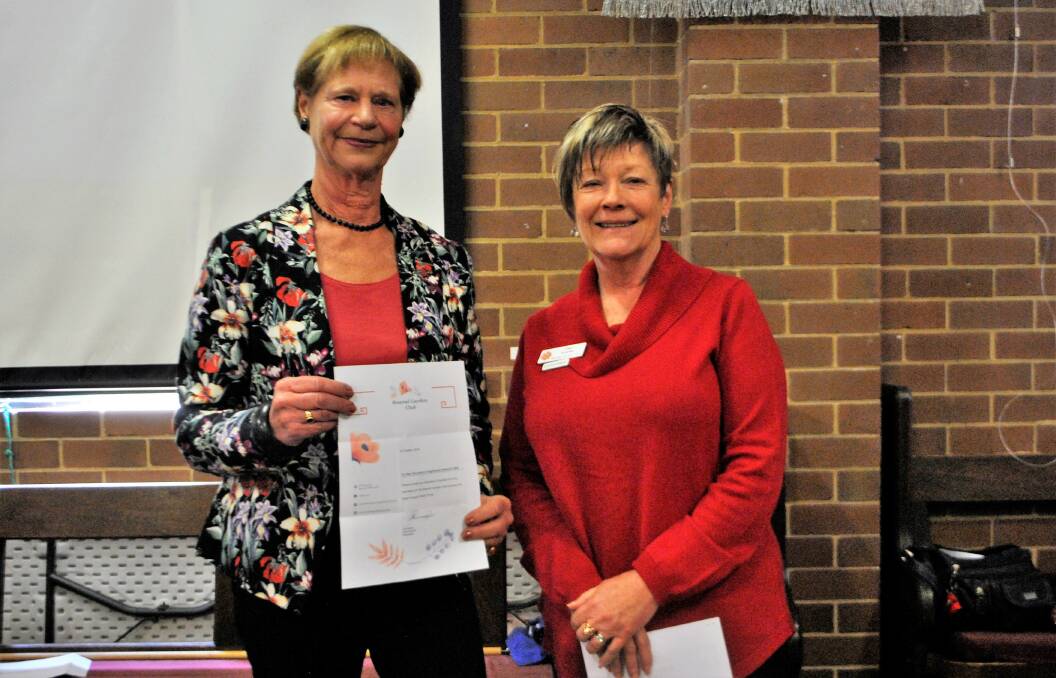 Bowral Garden Club president Deb Evered presented a $1000 donation for the evening branch drought appeal to president Maryke Archbold-Hession.