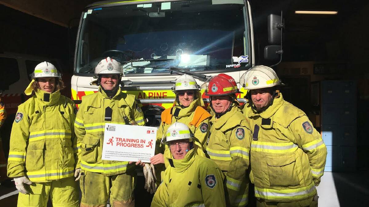 Firing up: Team members at Alpine/Aylmerton Rural Fire Brigade are participating in the Firies Climb for MND this October. Photo: Olivia Ralph