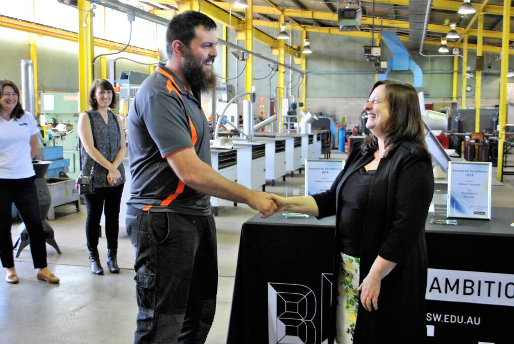 Year's best: Nathan Crawshaw receiving the 2018 Apprentice of the Year award by 1300apprentice CEO, Jane Kennedy. 