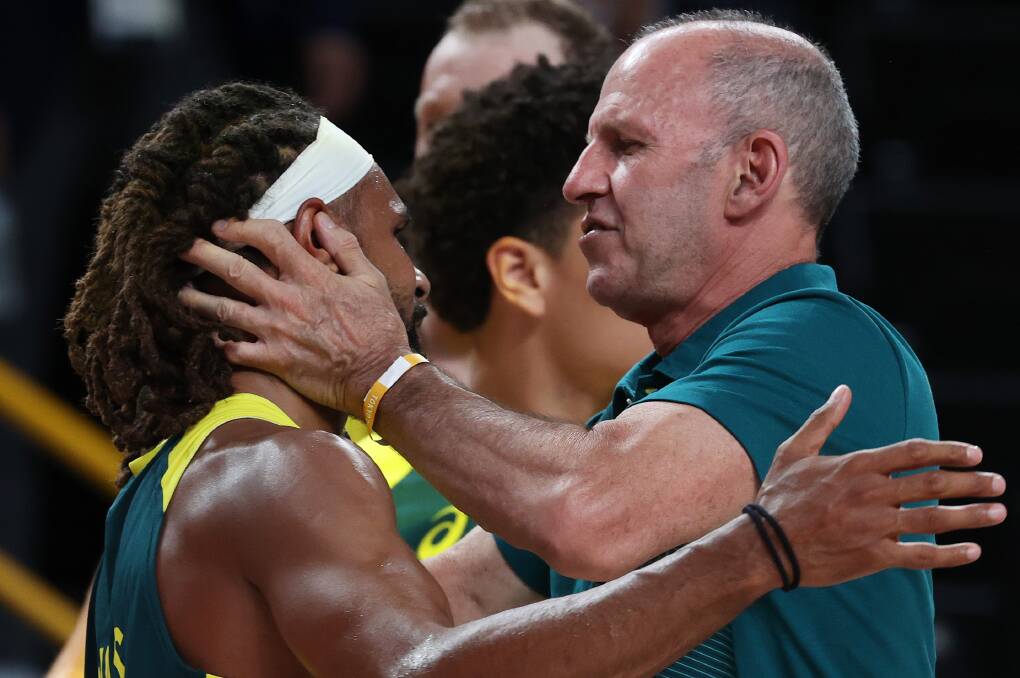 Pride in battle: Patty Mills with Boomers coach Brian Goorjian after winning a bronze medal. Picture: Kevin C. Cox/Getty Images
