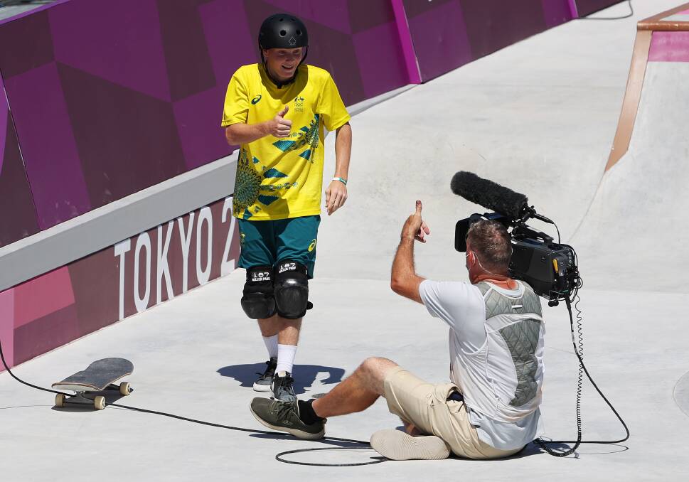 You OK, mate: Skateboarder Kieran Woolley checks on the cameraman after crashing into him during competition in Tokyo. Picture: Photo by Jamie Squire/Getty Images
