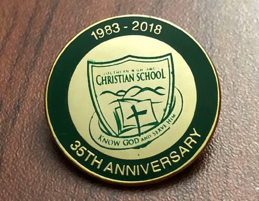 Memorabilia: Each Southern Highlands Christian School staff member and student was presented with a commemorative pin. Photo: supplied. 