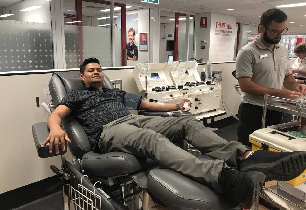 Arun Gautam from the Southern Highlands Nepali Community donating blood in Sydney. Photo: file.