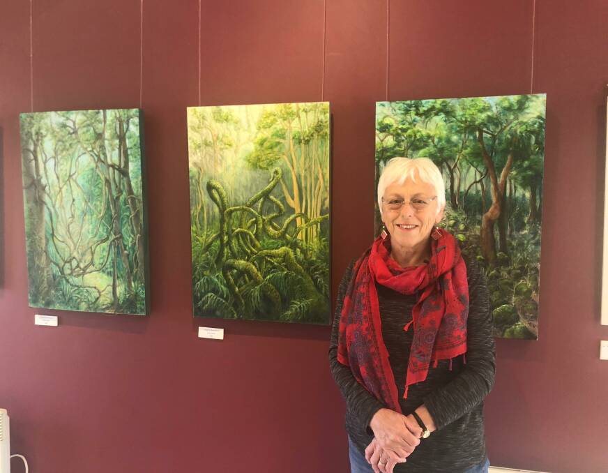 Glimpses in a Rainforest: Artist Cathryn Coutts in front of her latest collection at the Robertson Community and Technology Centre. Photo: Brooke Gibbs