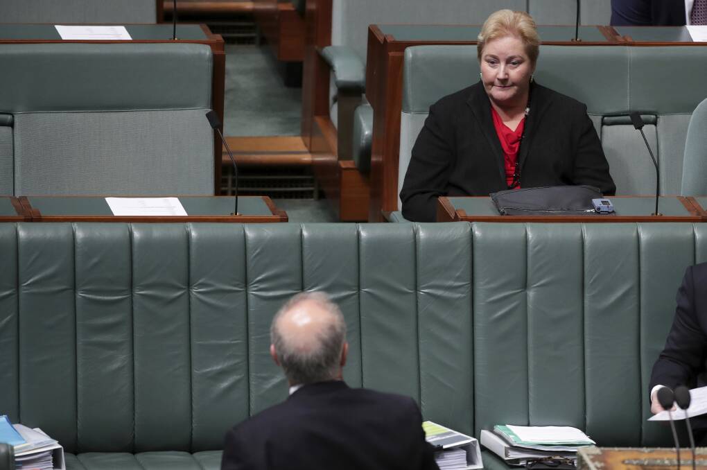 HAD ENOUGH: Ann Sudmalis shares a word with Prime Minister Scott Morrison in the House of Representatives on Tuesday.