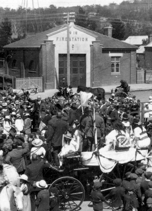 HEART OF TOWN: Crowd gathered in 1919 for the foundation of the memorial clock tower out front of Mittagong Fire Station. Photo: BDH&FHS.