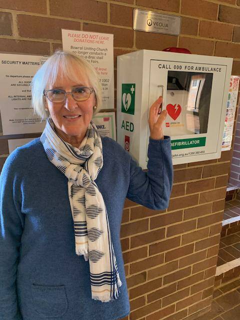 Lois Macadam, the new First Aid Officer at Bowral Uniting Church, with the new defibrillator.