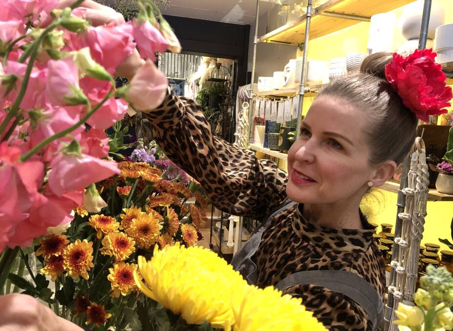 Southern Highlands resident Selina Dickson gained hands-on experience at Flowers on Argyle, before using a TAFE NSW qualification to switch careers from flight attendant to florist. Photo: supplied