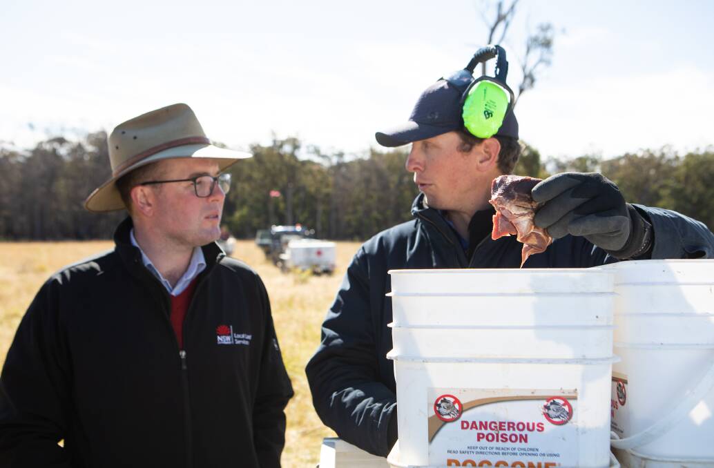 Minister for Agriculture Adam Marshall, left, with Local Land Services team leader Mark Tarrant, preparing meat used in the NSW Governments baiting programs.