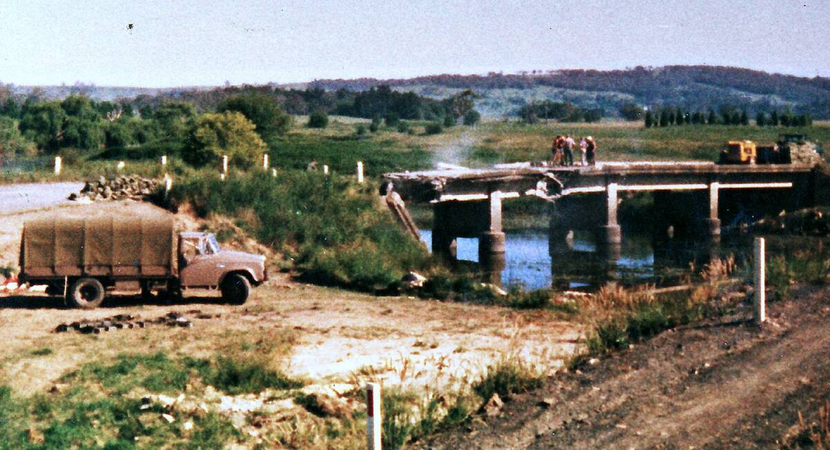 BETTER BRIDGE: The Army at Bong Bong in 1975 about to blow up the 1916 concrete road bridge. The current bridge replaced it. Photo: BDH&FHS.