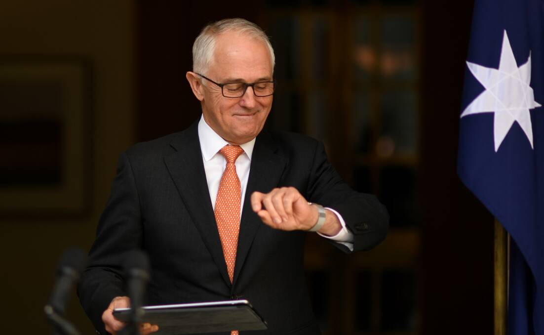 CALLING IT: Malcom Turnbull counting down the minutes until the High Court handed down its October 27 decision on the citizenship question. Photo: AAP/Lukas Coch.