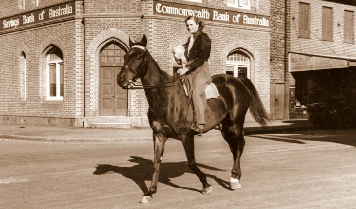 HORSE-POWER: Riding along Bong Bong St, Bowral, 1950s. Photo: BDH&FHS.