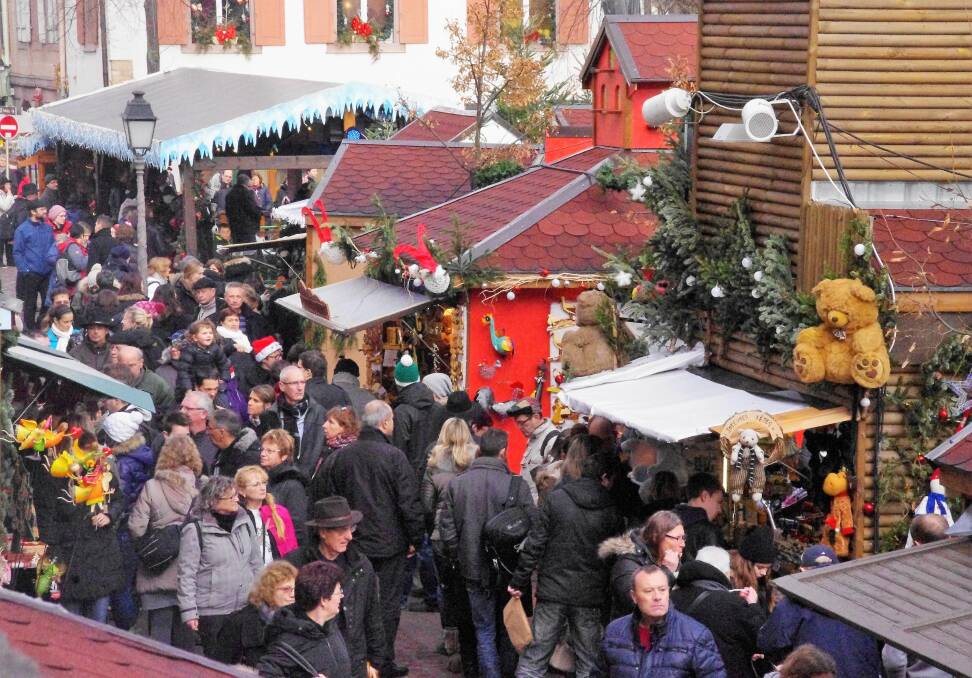 FESTIVE MAYHEM: You have to be made of tough stuff to survive a Christmas market, whatever the weather. Photo: Geoff Goodfellow.