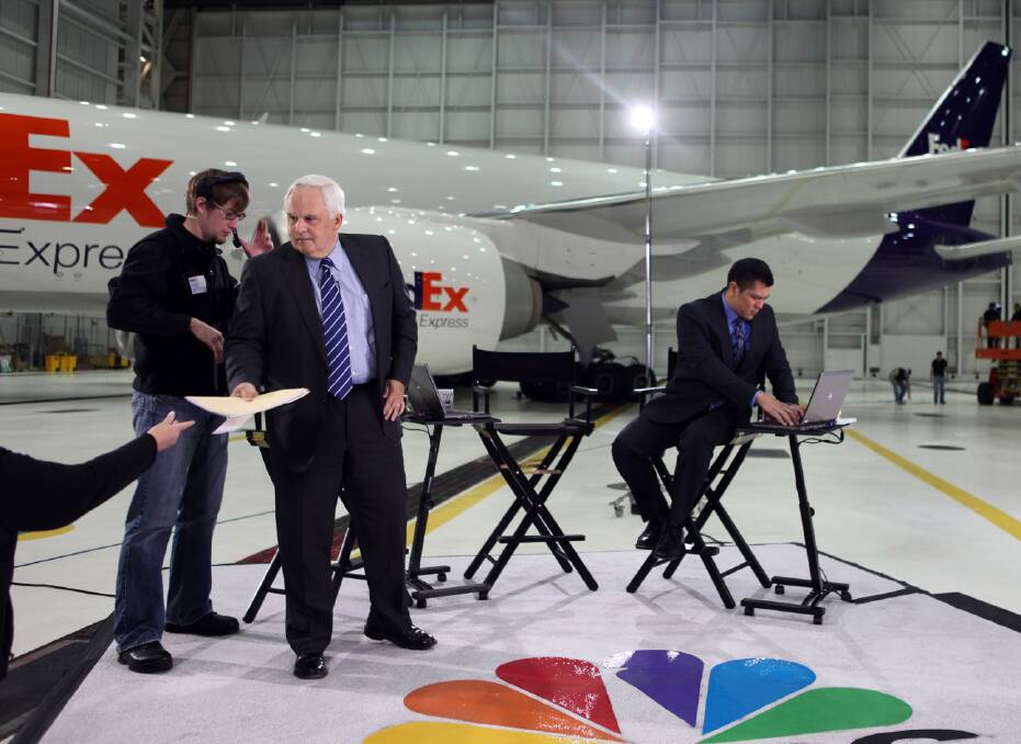 LUCKY GUY: Founder and chairman of FedEx Express, Fred Smith (centre) about to be interviewed for CNBC-TV at his Memphis, Tennessee hub. Photo: FedEx Express