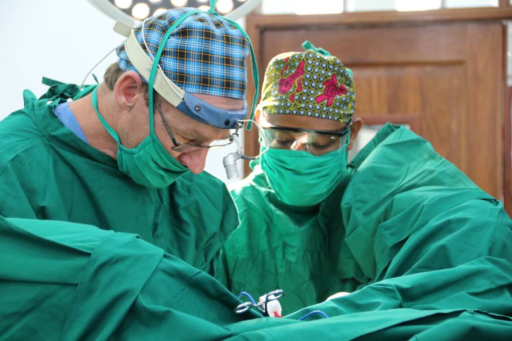 Dr Andrew Browning operating on a patient in Africa. Photo: courtesy Andrew Browning