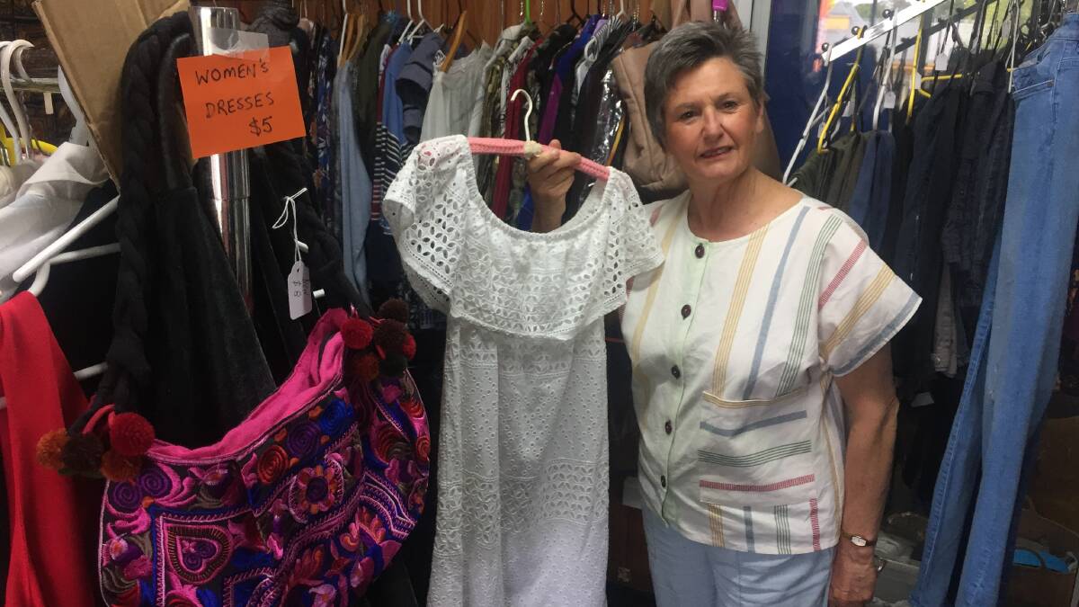 Karen Willmott shows off some of the treasures at the Robertson Burrow Community Op-shop. Photo: Michelle Thomas