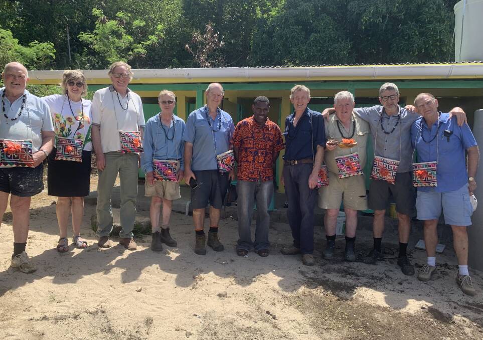 GOOD JOB: The Rotary team with the head master of Eles Centre School in front of the completed amenities block.