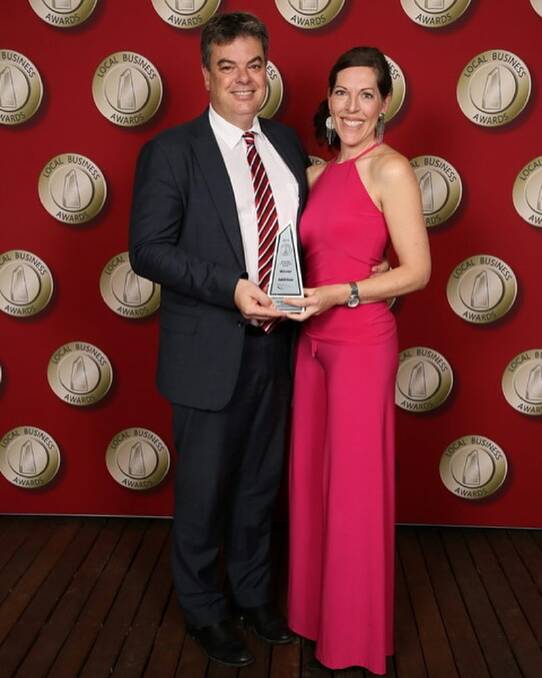 Chris and Mandy Barnes of Kalinya Estate receiving one of their many awards - 2019's Business of the Year win at the Wollondilly Local Business Awards. Photo: supplied