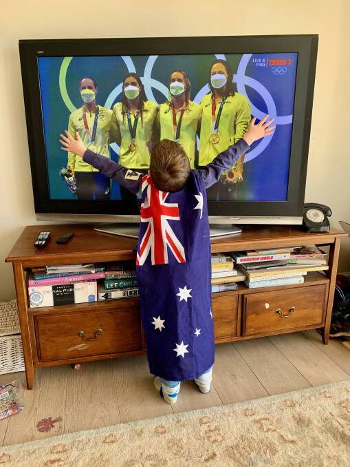 GO AUSSIES: Christopher Galwey, 5, of Berrima, watching Australia win our first gold medals at the Olympics games in Tokyo. Photo: Tanya Galwey