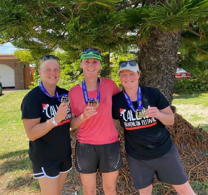 BACK IN THE GAME: Kristen Wilson, Kellyanne Hinchcliffe and Kirrilee Bracht celebrate their success at the Callala Beach Triathlon. Photo: supplied