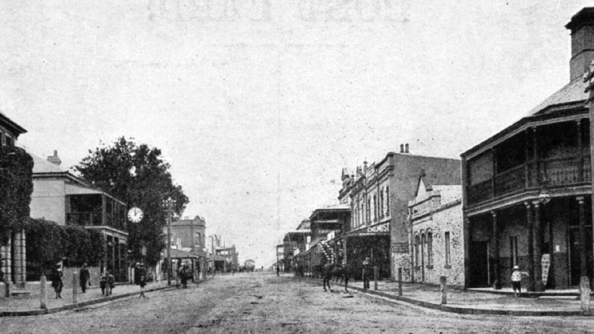 NEW PREMISES: The buildings at centre right on Bong Bong Street, Bowral, are those that replaced the shops destroyed by fire in 1890, with the Royal Hotel in foreground, c1900. Photo: BDHandFHS.