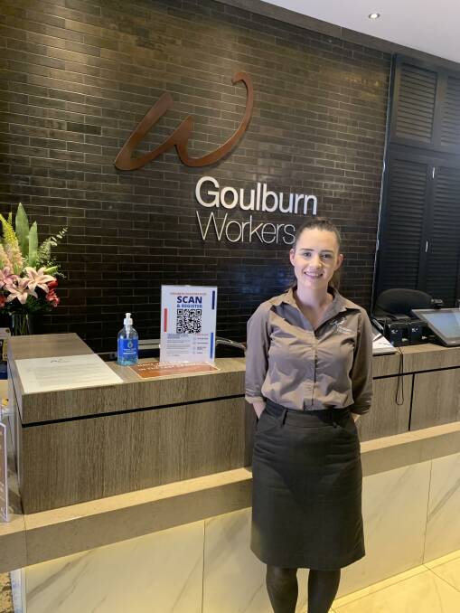 If you can't scan a QR code, don't worry - you can still get a feed. Staff members like Talisa Kent at the Goulburn Workers Club will enter your information for you on the system.