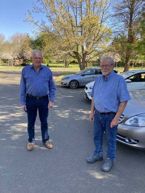 Robert Brown and Phillip Moscatt stand in the section of the Bowral Pool carpark where the RVM could be built. Photo: Michelle Haines Thomas