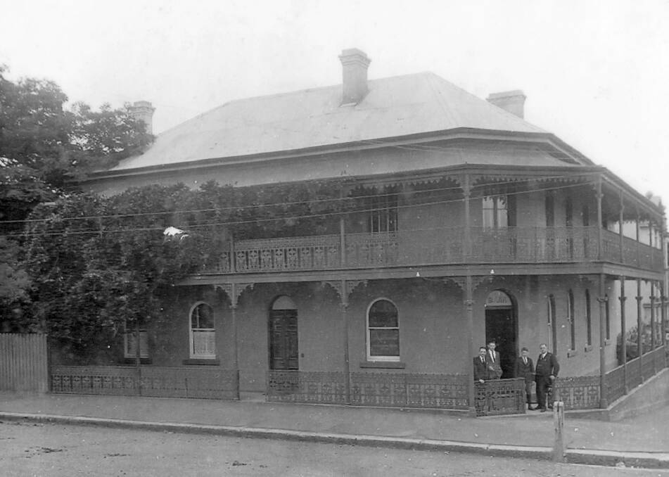SOLID AND SAFE: The ES&A Bank at Moss Vale in 1921. The four men at front entrance are presumably manager AG Miller and employees. Photo: D Baxter