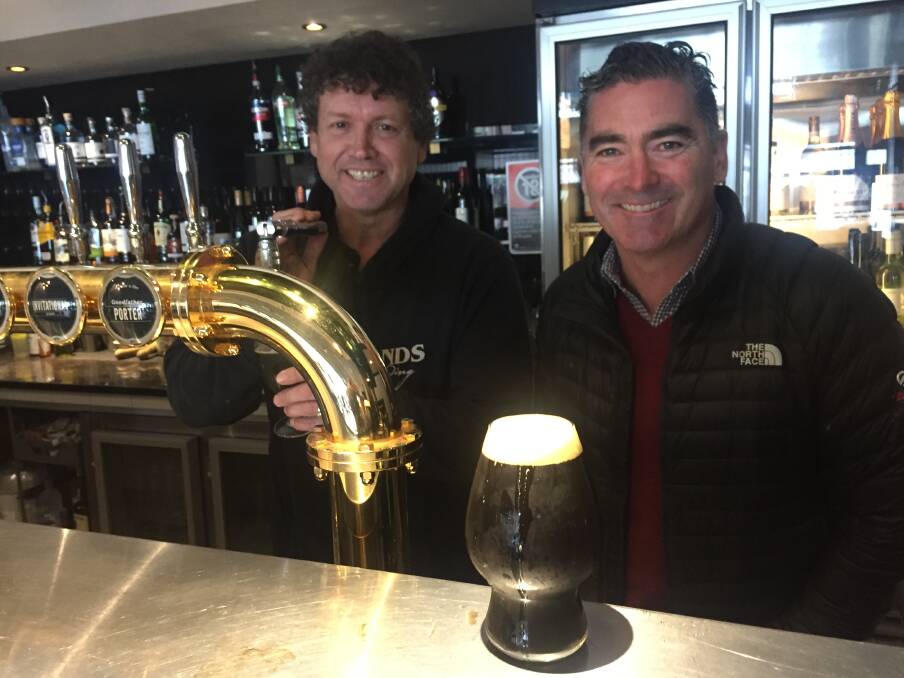 FOR THE DADS: Cameron James and Ben Twomey from Southern Highlands Brewery and Taphouse at Moss Vale with the Goodfather porter that has been "walking out the door". Photo: Michelle Thomas