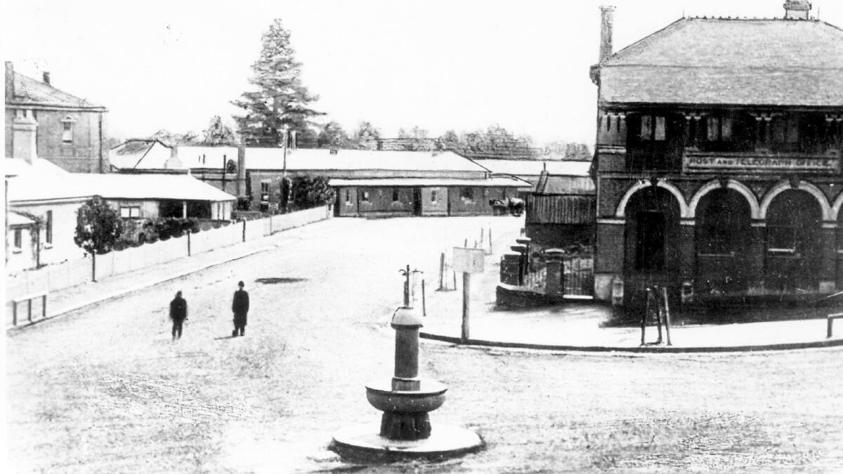 TOWN HUB: In this c1900 view of Bay Street, Moss Vale, the police/court precinct is just visible beyond fence on left, the Post Office is on right, and railway station is at rear. Photo: BDH&FHS