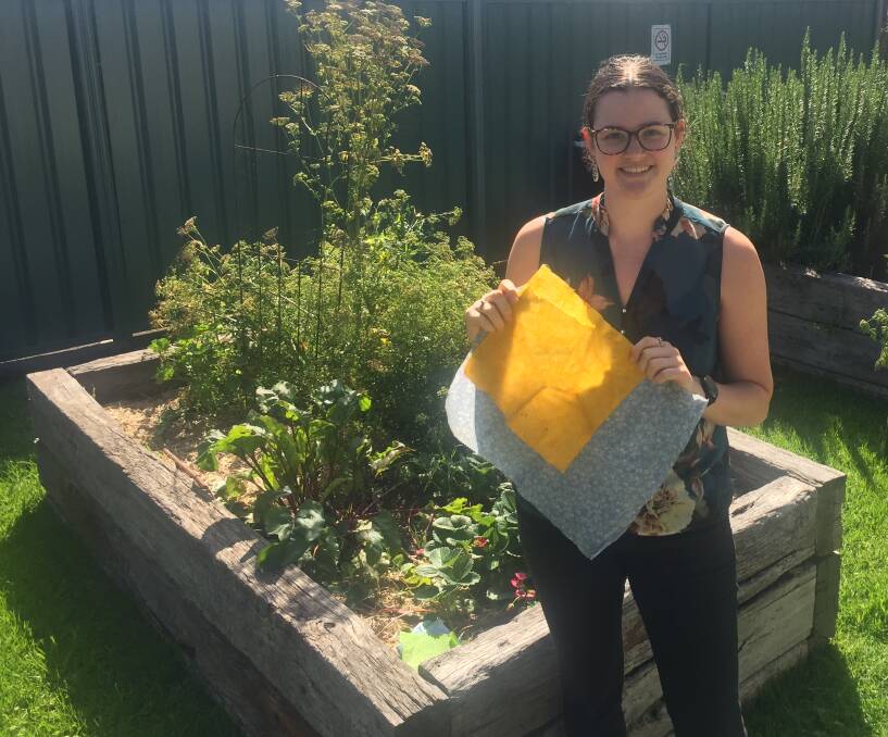 EASY SWAPS: Waste education project and policy officer Phoebe Ward with some of the beeswax wraps you can learn to make in a waste reduction workshop.