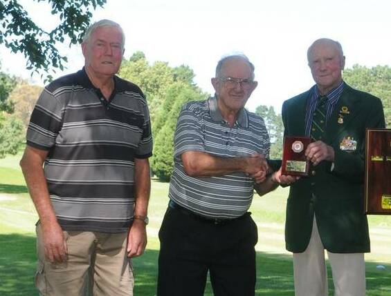 Russ Watman (centre) pictured with fellow Berrima District Sporting Association committee member Lyle Schofield, presenting an award to . Photo: Lauren Wright.