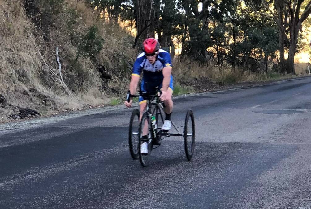 On the road: Stuart Jones on an incline during his time with the Goulburn Cycle Club. Photo: Supplied.