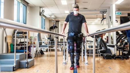 Chris Cairns is using an exoskeleton machine to help him walk again. Picture: Karleen Minney