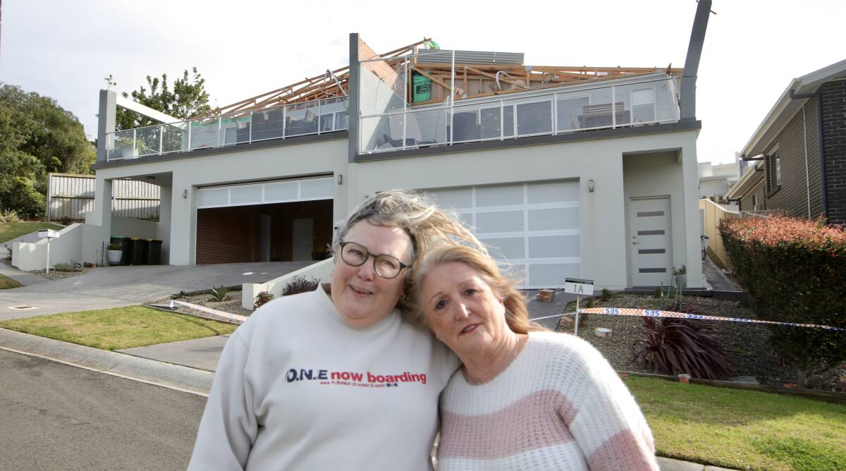 Helen McKeith and Gail Snodgrass outside their Ellerston Parkway duplex houses in Shell Cove which were severely damaged in Tuesday night's storm. Photos: Sylvia Liber