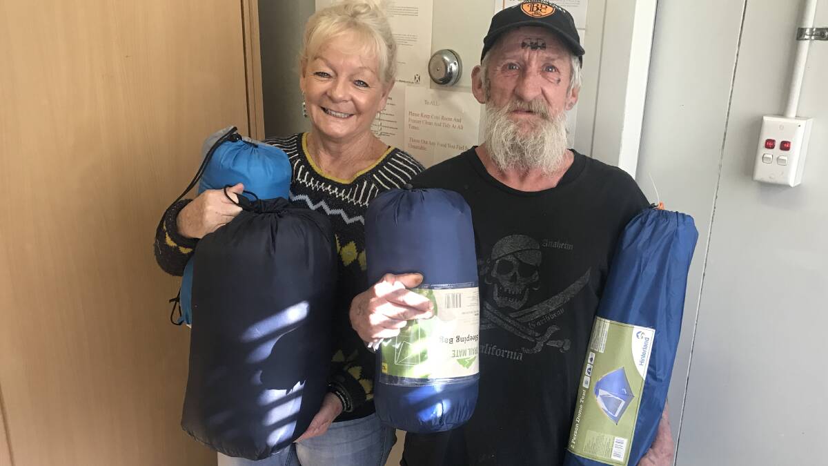 DONATION: Wesley Community Centre co-ordinator Karen Zaini and client John Ryan with some of the donated items. Picture: Brendan Crabb