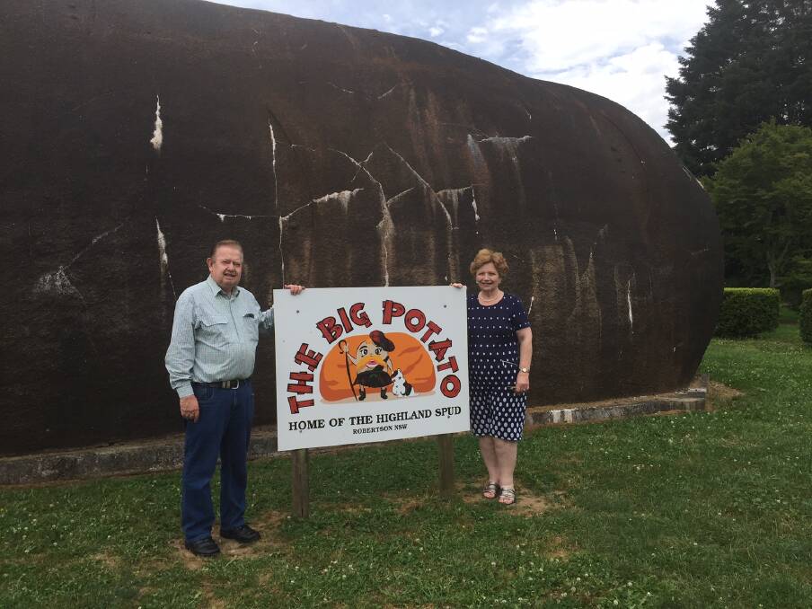 FOR SALE: Heather and Neil Tait with the Big Potato in 2017. The land housing the potato is now up for sale, with a price guide of $920,000. Picture: Michelle Thomas