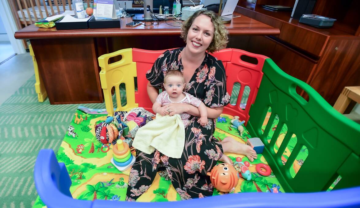 Member for Canberra Alicia Payne with baby Elena in her Parliament House office this week. Picture: Karleen Minney