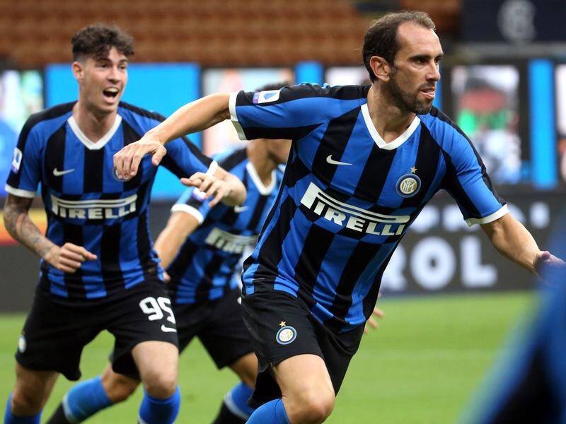 Inter's Diego Godin (r) celebrates after scoring in their 3-1 Serie A win over Torino on Monday.