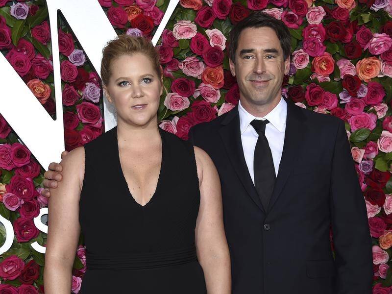 Actress Amy Schumer has announced she and her husband Chris Fischer are expecting their first child.