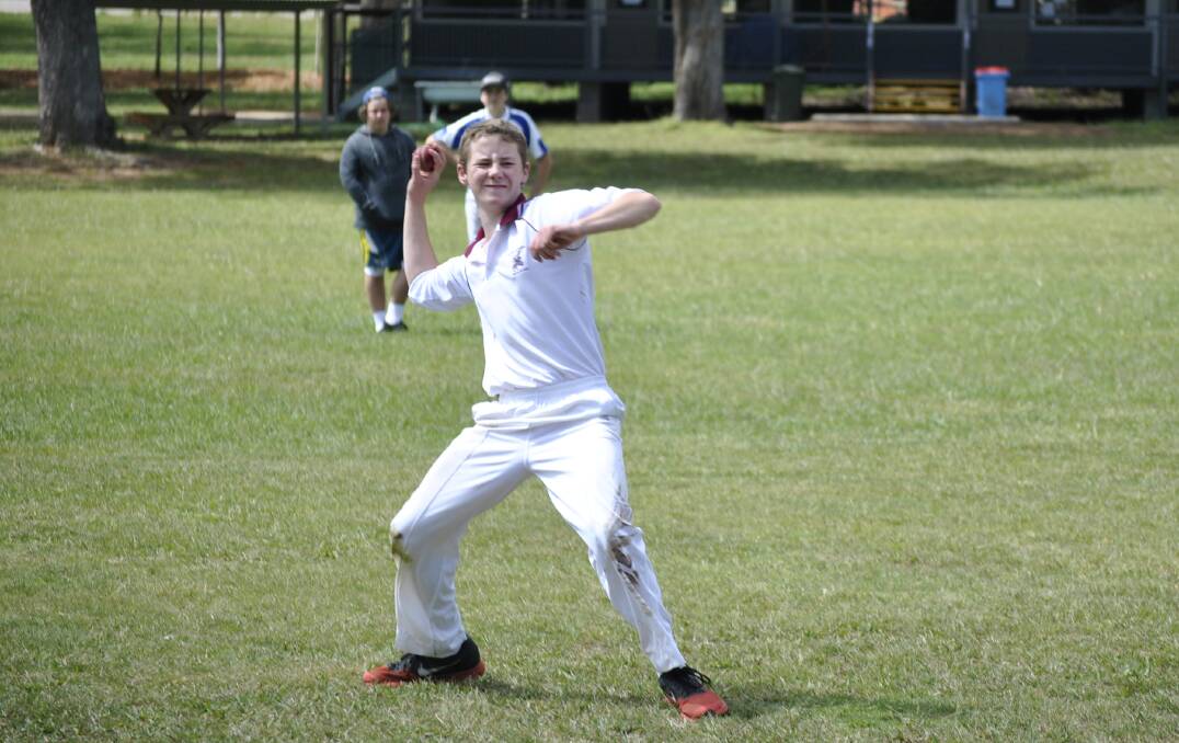 Chevalier cricketer Lachlan Larney-Dawson throws the ball back from the boundary.