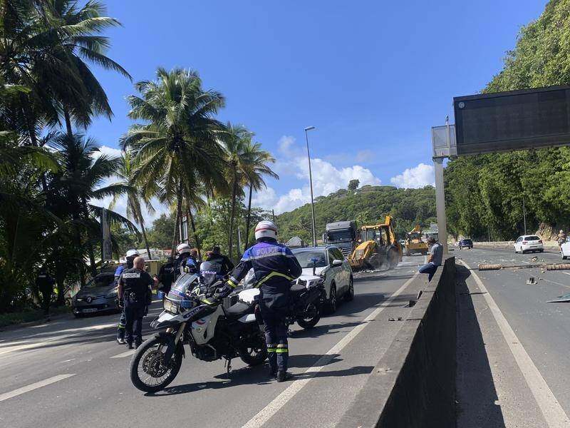 Authorities say a police officer was injured after unrest over COVID-19 restrictions in Guadeloupe.
