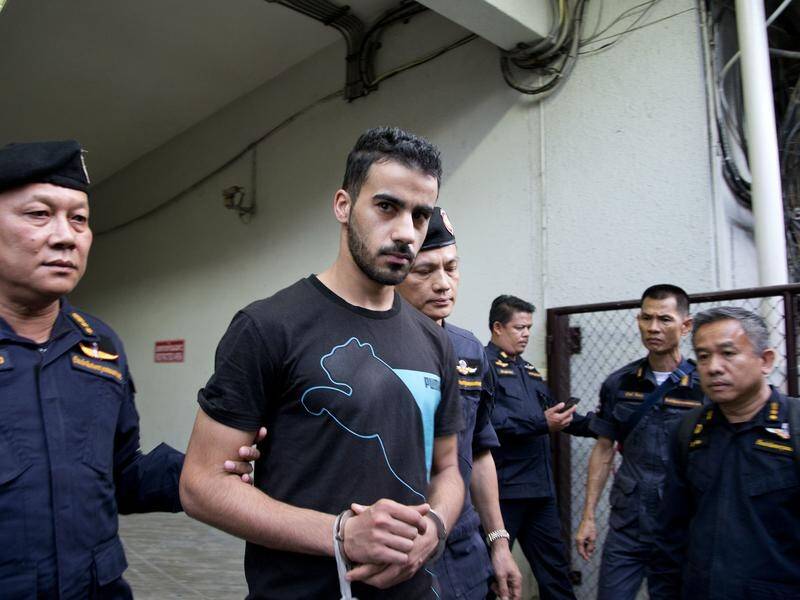 Thai prison guards lead Bahraini football player Hakeem AlAraibi from a court house in Bangkok.