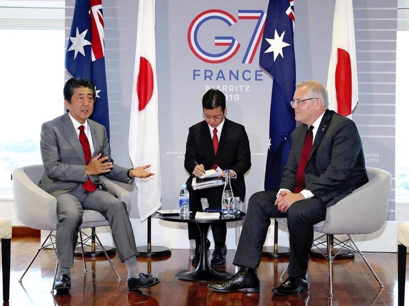 Japan's PM Shinzo Abe (L) and Scott Morrison focused on security issues during virtual talks.