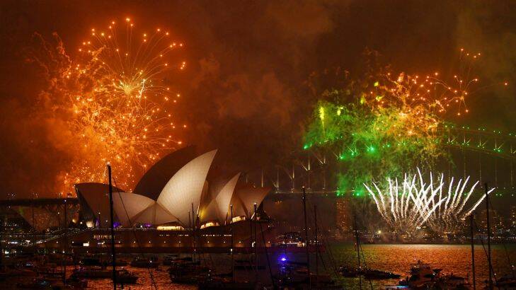 Fireworks explode over Sydney Harbour during New Year's Eve celebrations in Sydney, Sunday, December 31, 2017. (AAP Image/David Moir) NO ARCHIVING